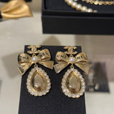 18K CC 25K Golden Bow Earrings