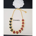 Chanel necklace with heart-shaped pendants on a white background