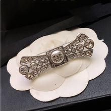 18K CC Bow Tie Diamond Brooch